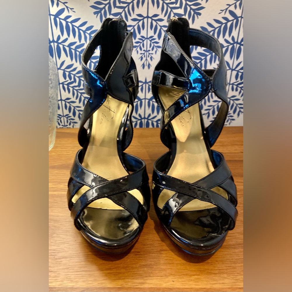 Black patent strappy platform heels.  Size 8.